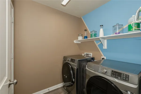 a view of storage and utility room with washer and dryer