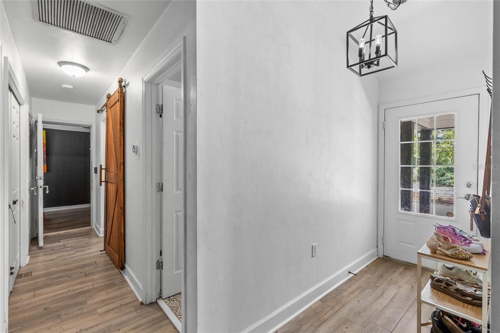5309 Northeast 60th Avenue High Springs, FL 32643 - Photo 22 of 34 a view of hallway with wooden floor and stairs