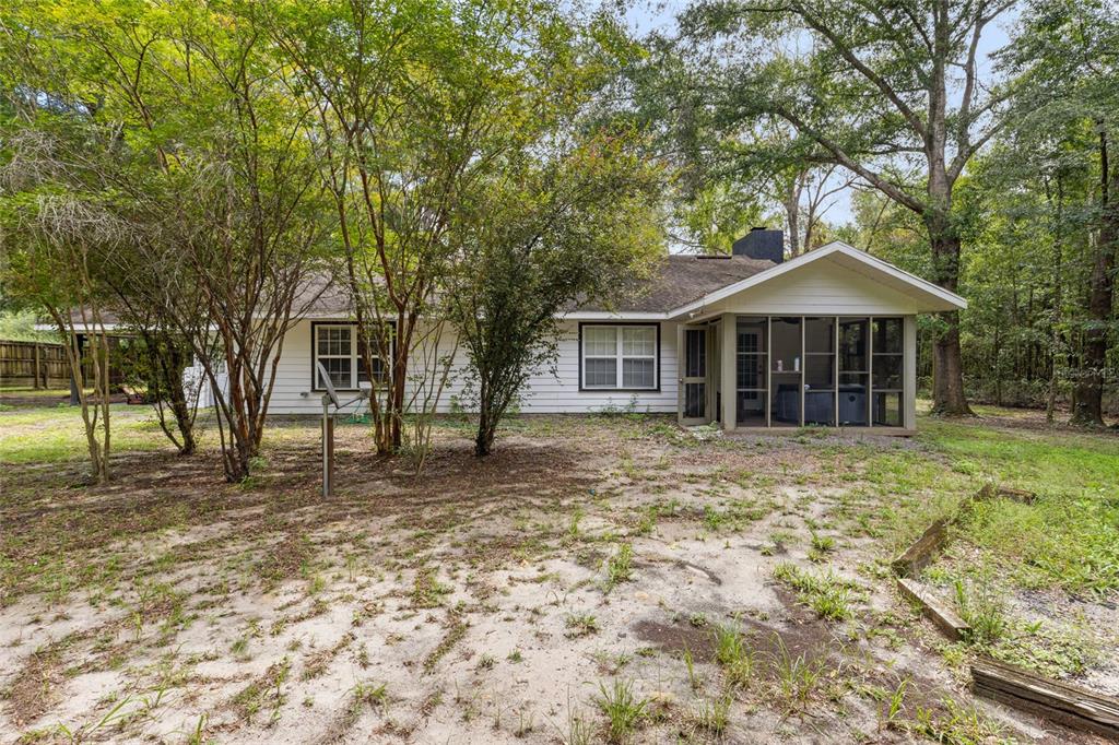 5309 Northeast 60th Avenue High Springs, FL 32643 - Photo 32 of 34 a front view of a house with a garden