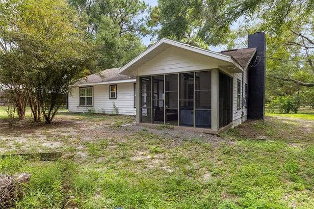 a house with trees in the background