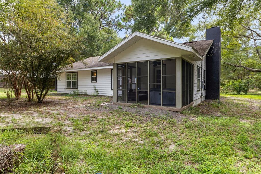 5309 Northeast 60th Avenue High Springs, FL 32643 - Photo 33 of 34 a house with trees in the background