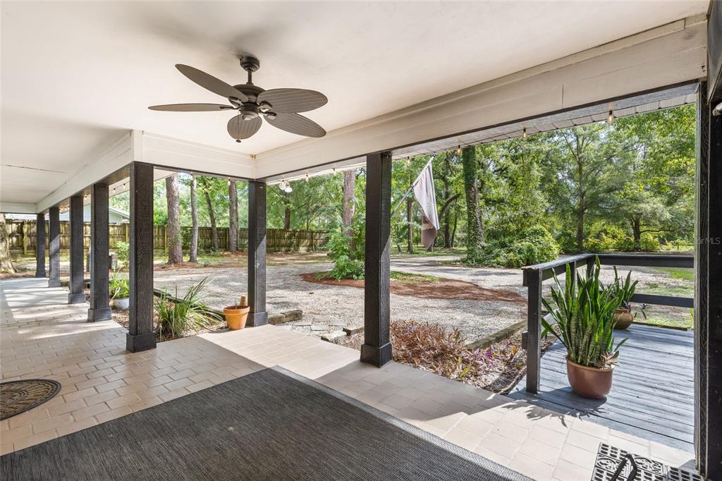 5309 Northeast 60th Avenue High Springs, FL 32643 - Photo 6 of 34 a view of a porch with furniture and garden