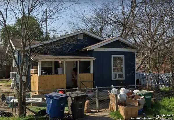 a front view of a house with sitting area
