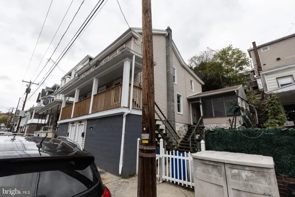 a view of a house with a street
