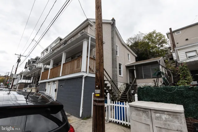 a view of a house with a street