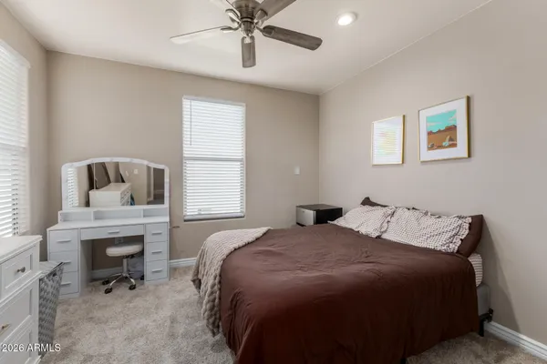 a bedroom with a bed and a fireplace