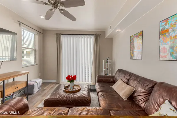 a living room with furniture and a window