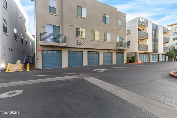 a front view of a building with a road