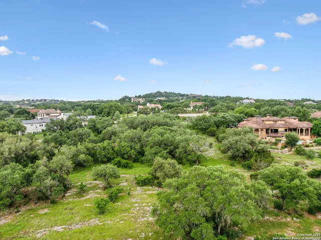 an aerial view of residential building with parking space