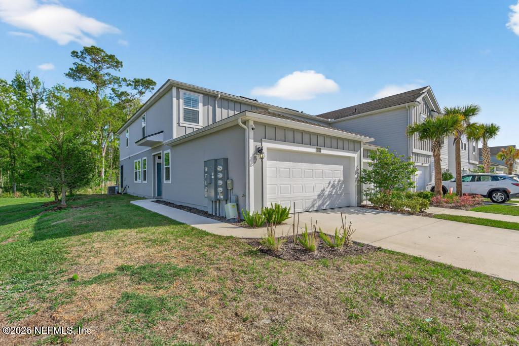 45 Seaport Breeze Road St. Augustine, FL 32095 - Photo 6 of 88 a view of a house with a yard and potted plants