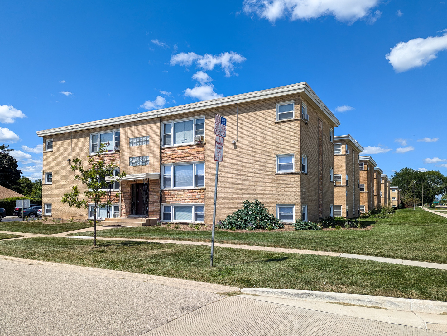 a front view of building with yard