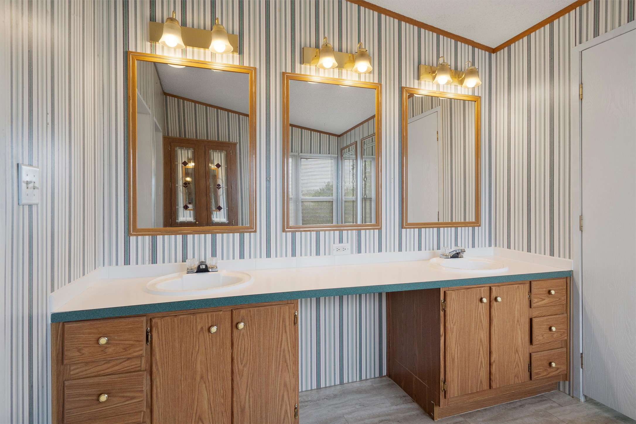 3075 Old Black Colony Road, Unit D Buda, TX 78610 - Photo 13 of 26 An expansive double vanity offers abundant storage and dedicated counter space.