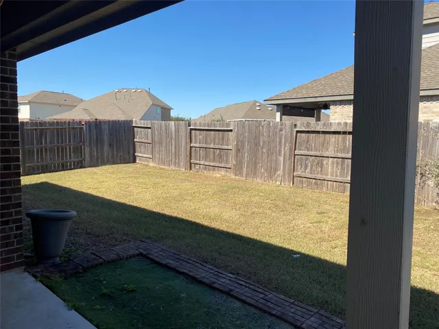a view of swimming pool with a yard