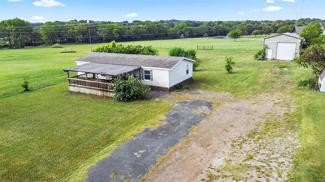 a view of a garden with lawn chairs