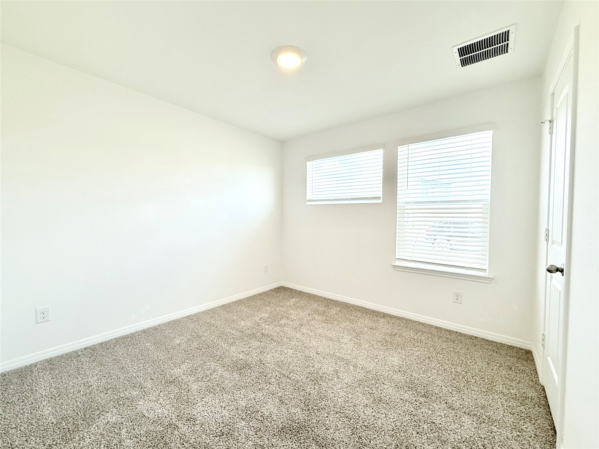 598 Gladiola Loop Kyle, TX 78640 - Photo 24 of 33 Carpeted spare room featuring baseboards