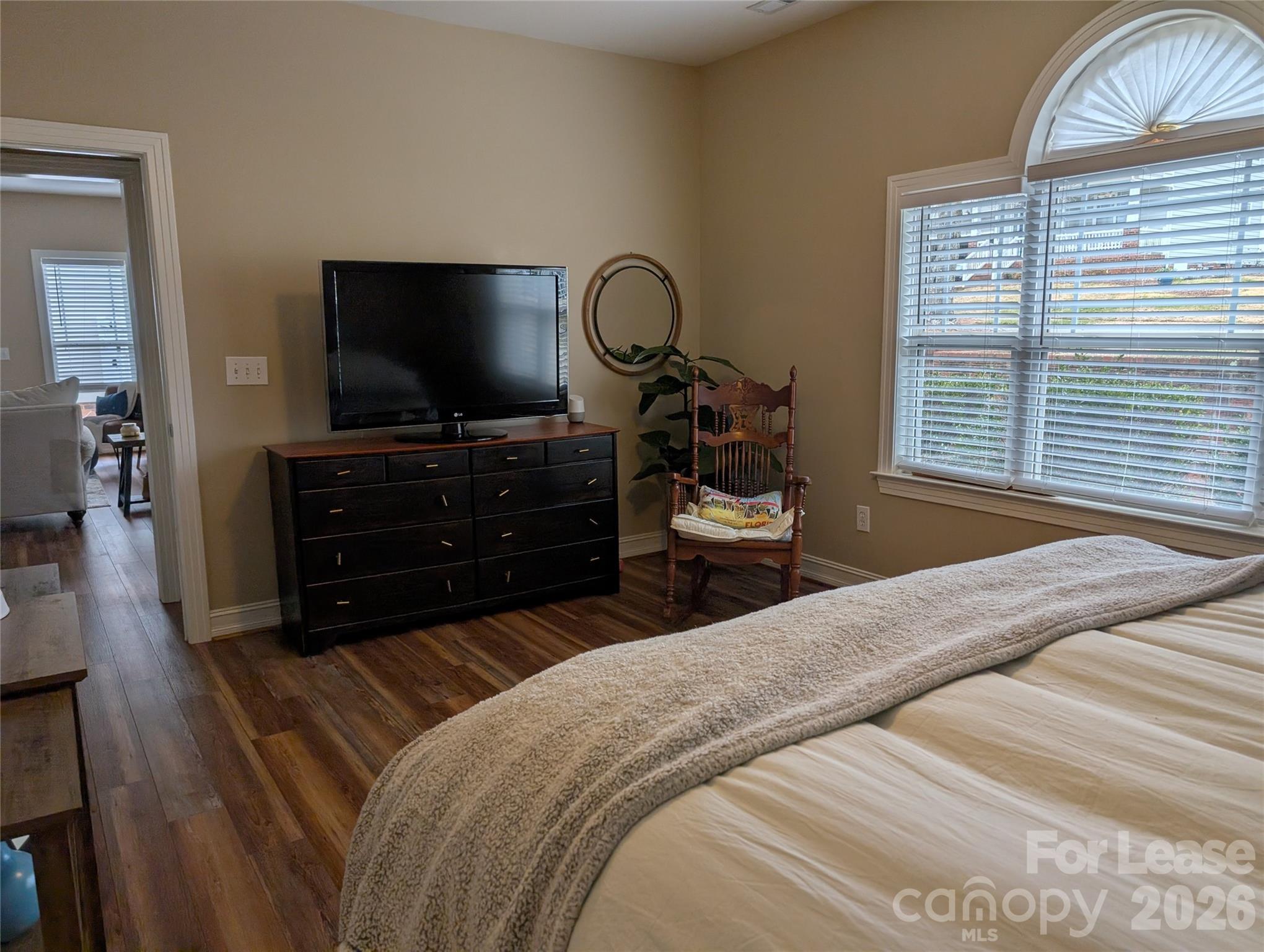 20207 Colony Point Lane Cornelius, NC 28031 - Photo 15 of 26 a bedroom with a bed and a flat screen tv