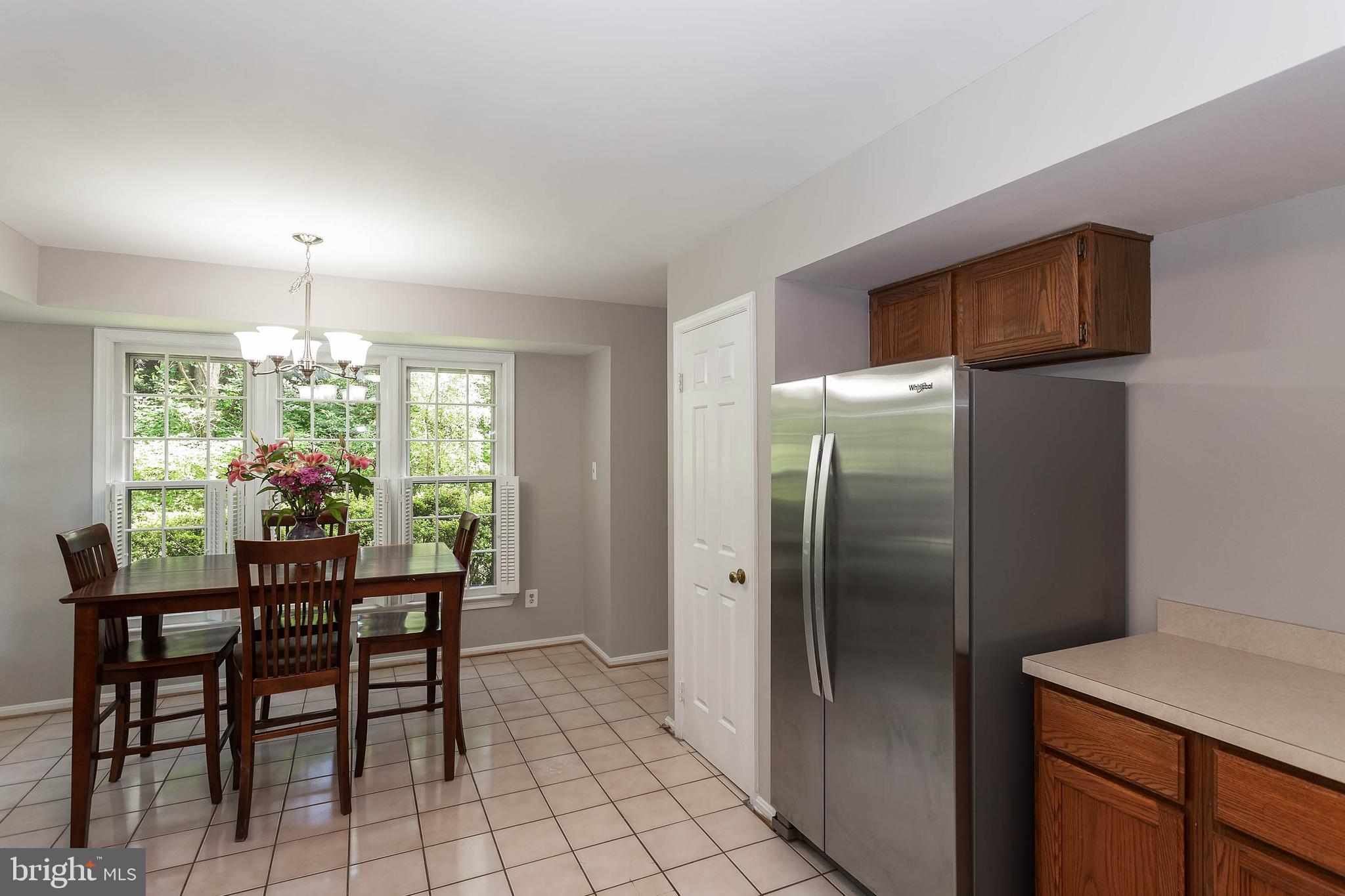 11701 Old Bayberry Lane Reston, VA 20194 - Photo 10 of 36 Lots of natural light to side garden