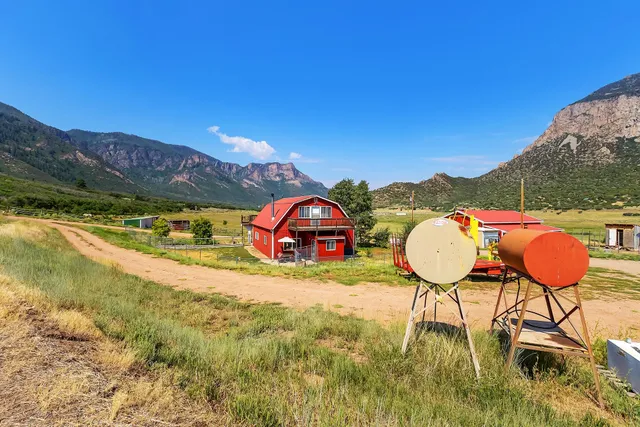 a view of a swimming pool with a patio and a yard