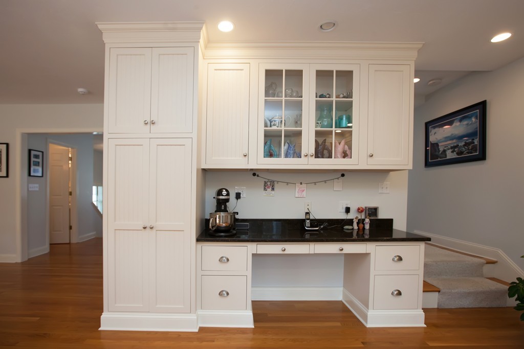 44 Kenneth Road Scituate, MA 02066 - Photo 13 of 30 a kitchen with stainless steel appliances white cabinets and wooden floor
