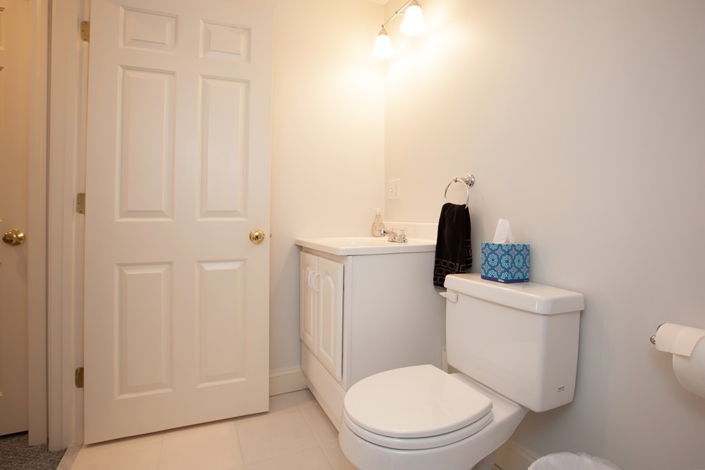 44 Kenneth Road Scituate, MA 02066 - Photo 23 of 30 a white toilet sitting next to a bathroom sink