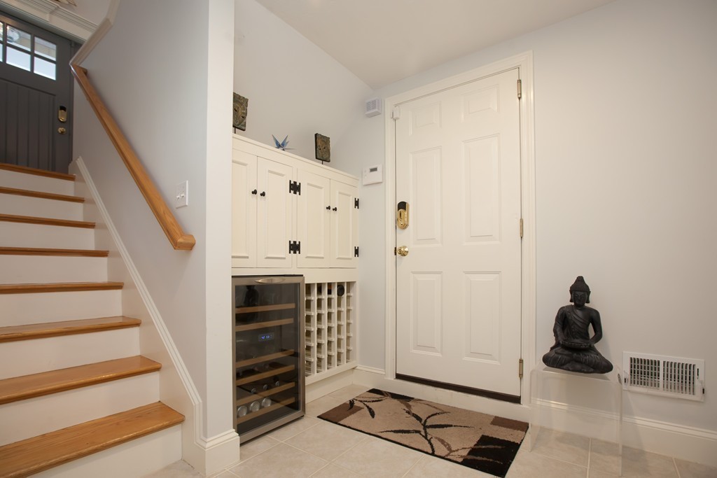 44 Kenneth Road Scituate, MA 02066 - Photo 24 of 30 a view of a livingroom with an empty room and stairs