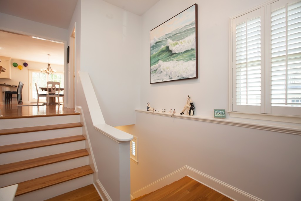 44 Kenneth Road Scituate, MA 02066 - Photo 3 of 30 a view of hallway with window and wooden floor