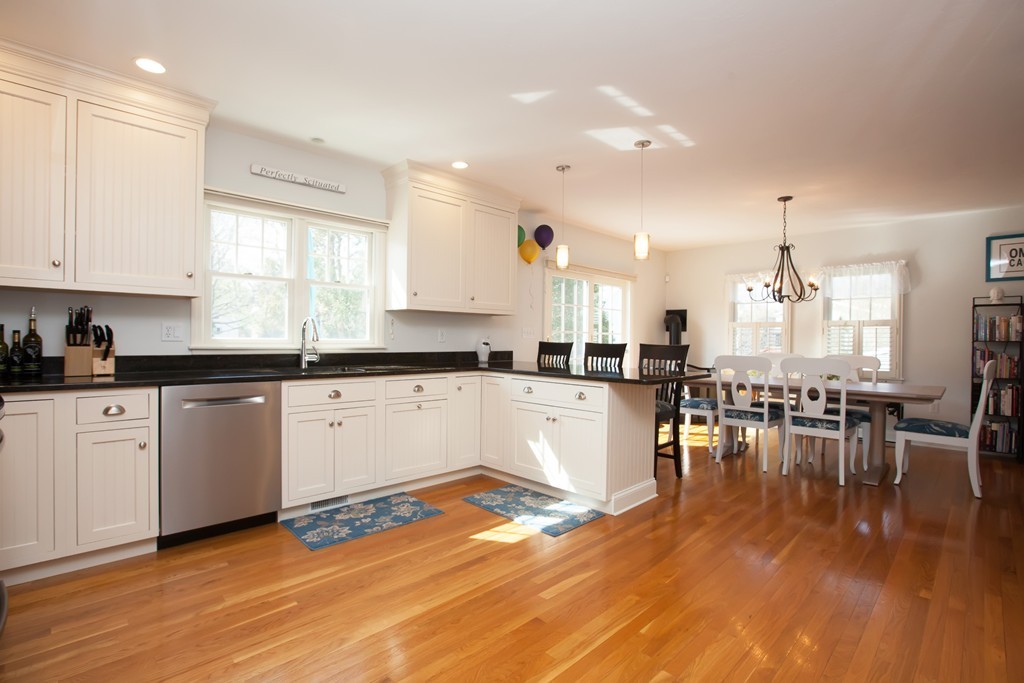 44 Kenneth Road Scituate, MA 02066 - Photo 10 of 30 a large white kitchen with lots of counter and view living room