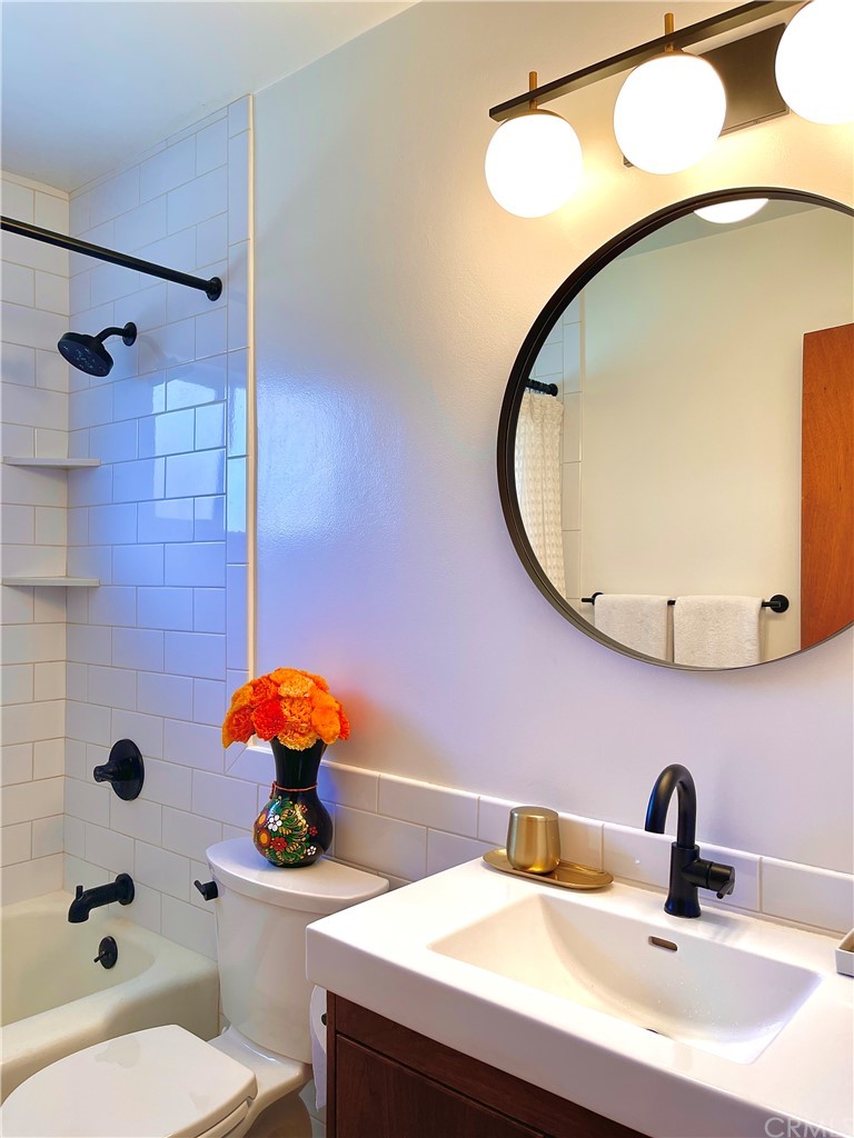 1245 Palm Avenue Chico, CA 95926 - Photo 11 of 19 a bathroom with a sink mirror and toilet