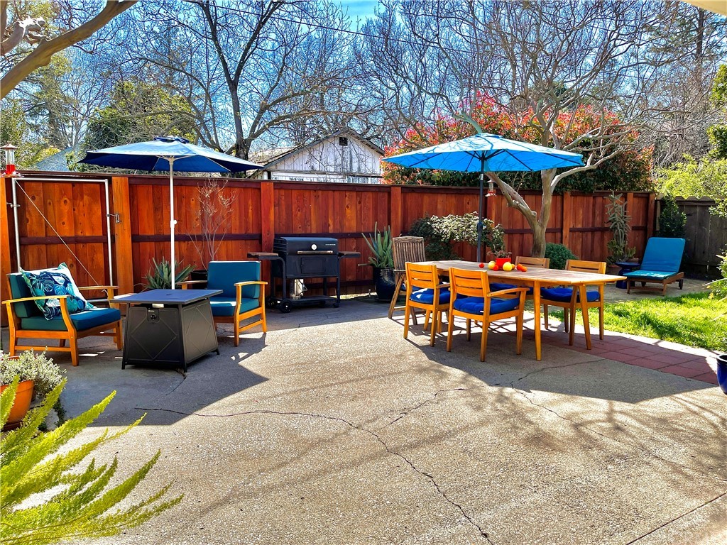 1245 Palm Avenue Chico, CA 95926 - Photo 14 of 19 a view of a patio with a table and chairs under an umbrella