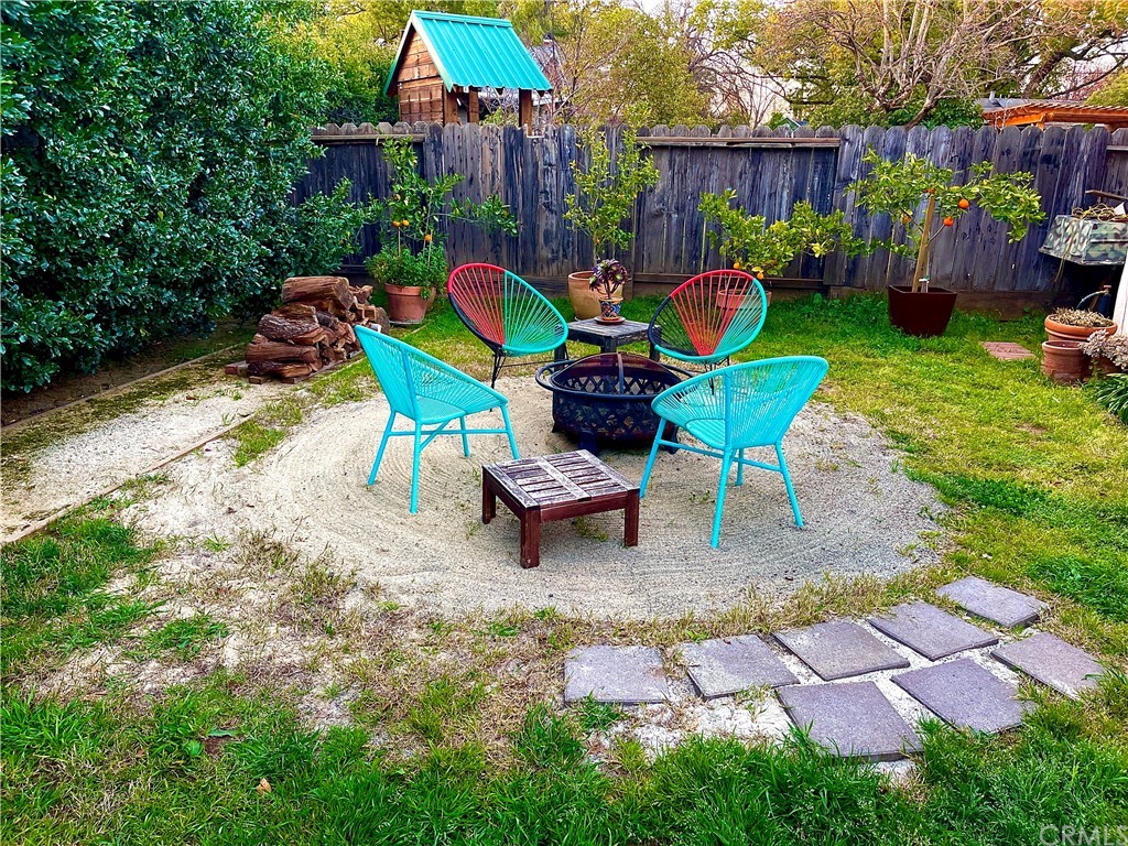 1245 Palm Avenue Chico, CA 95926 - Photo 16 of 19 a chair and a table in a garden