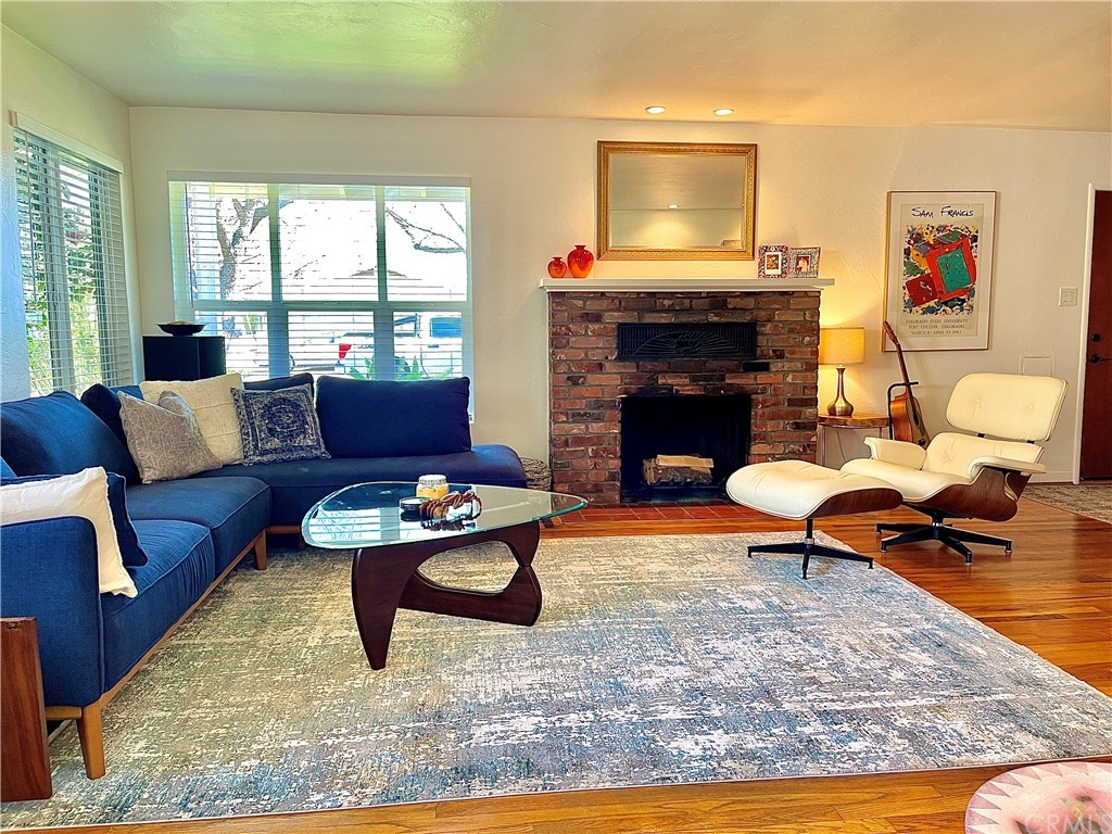 1245 Palm Avenue Chico, CA 95926 - Photo 4 of 19 a living room with furniture a fireplace and a table