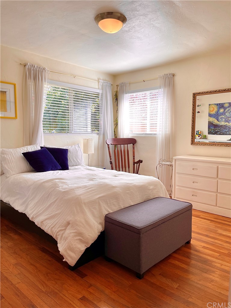 1245 Palm Avenue Chico, CA 95926 - Photo 8 of 19 a spacious bedroom with a bed and wooden floor