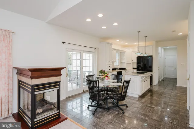 a living room with furniture and a mirror