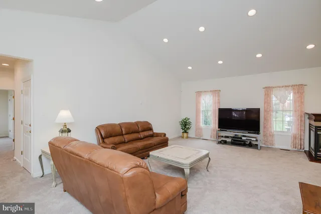 a bathroom with a double vanity sink mirror and cabinets