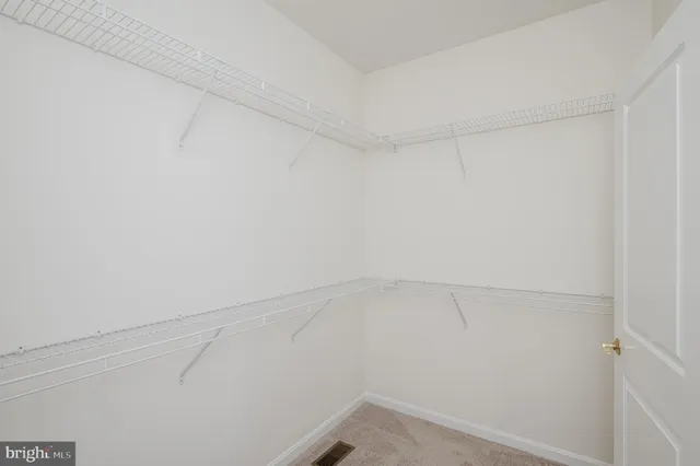 a aerial view of a house with a yard and outdoor seating