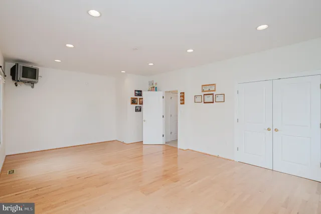an aerial view of a house with swimming pool and garden