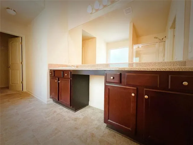a kitchen with a sink and a window