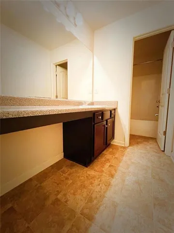 a view of a kitchen with wooden floor