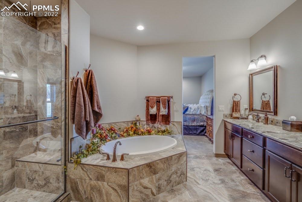 119 Rocchio Drive Florence, CO 81226 - Photo 21 of 48 a bathroom with a tub sink and mirror