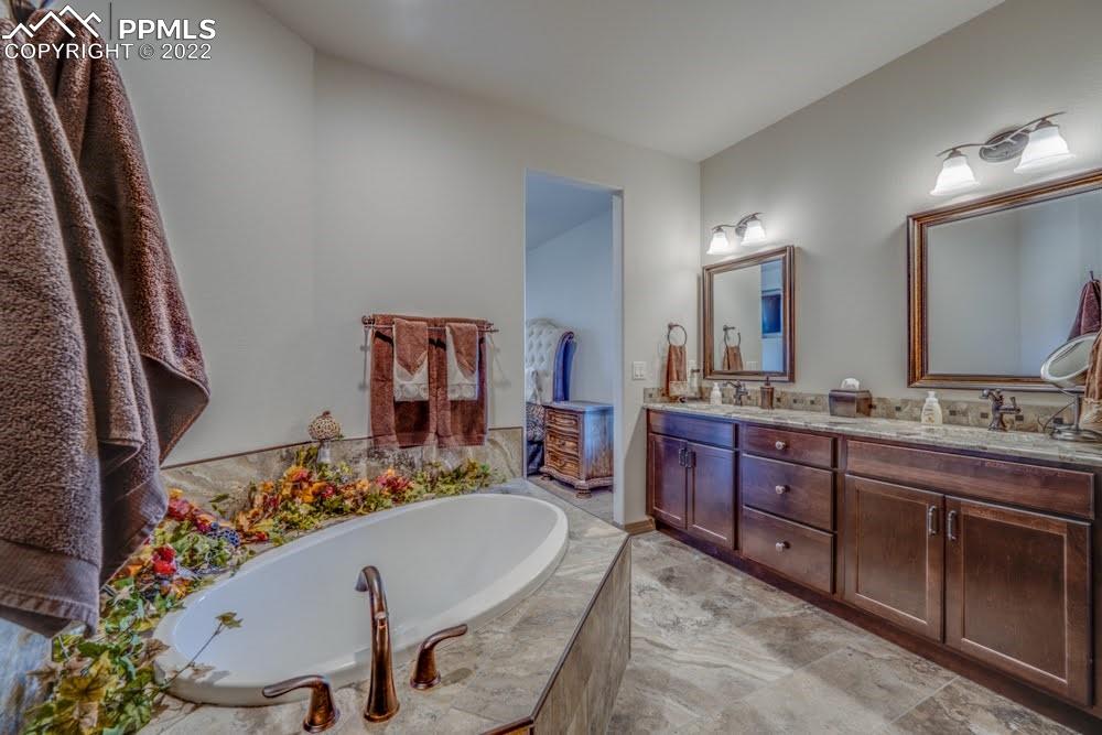 119 Rocchio Drive Florence, CO 81226 - Photo 22 of 48 a room with furniture a mirror and sink