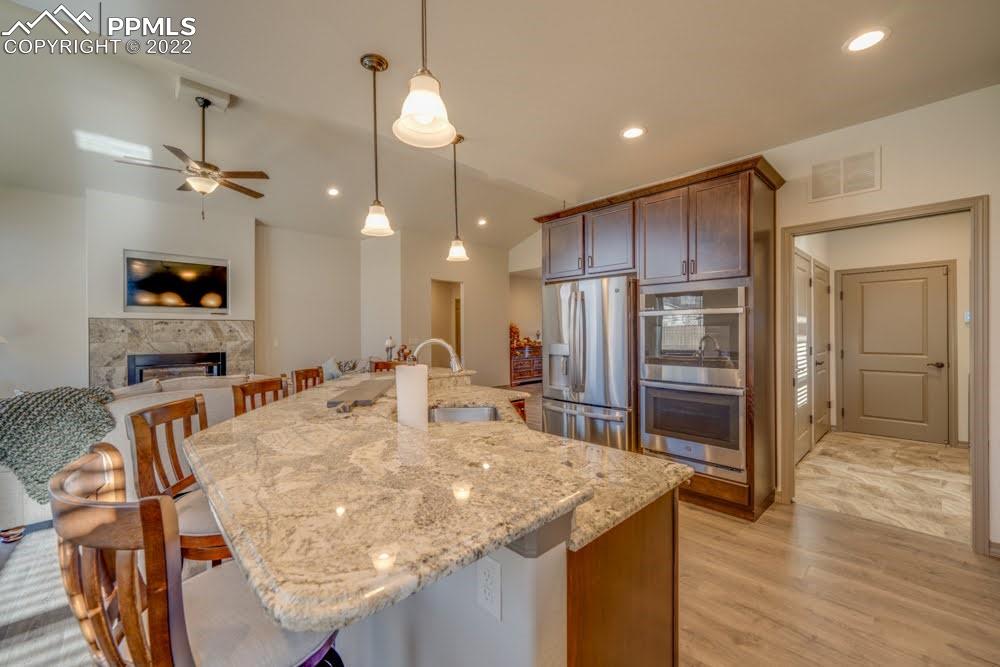 119 Rocchio Drive Florence, CO 81226 - Photo 3 of 48 a kitchen with stainless steel appliances granite countertop a sink a stove and a refrigerator
