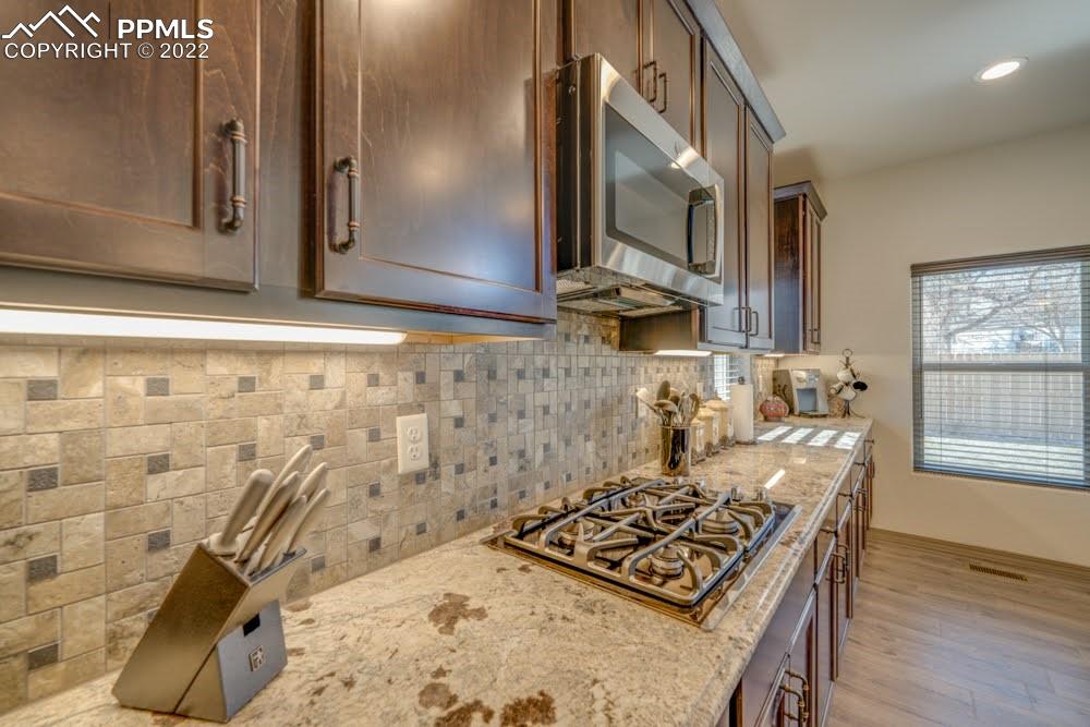 119 Rocchio Drive Florence, CO 81226 - Photo 31 of 48 a kitchen with a stove a sink and a microwave
