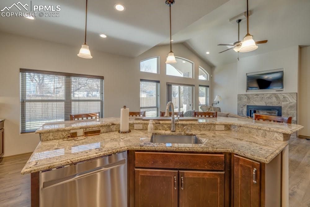 119 Rocchio Drive Florence, CO 81226 - Photo 34 of 48 a view of a kitchen with granite countertop a center island a stove and a chandelier