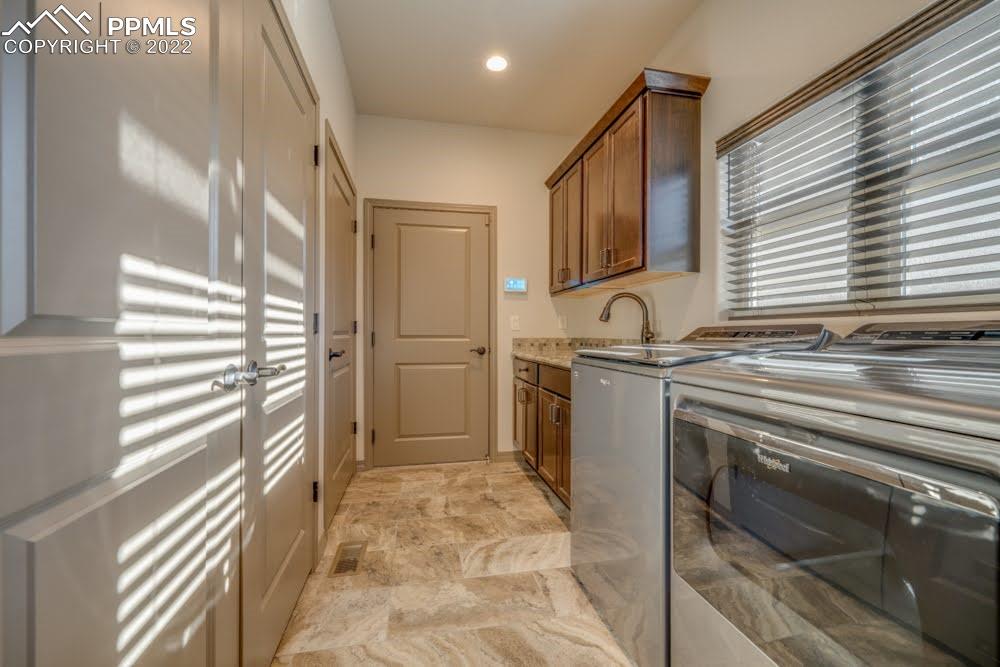 119 Rocchio Drive Florence, CO 81226 - Photo 35 of 48 a kitchen with granite countertop a sink and a refrigerator