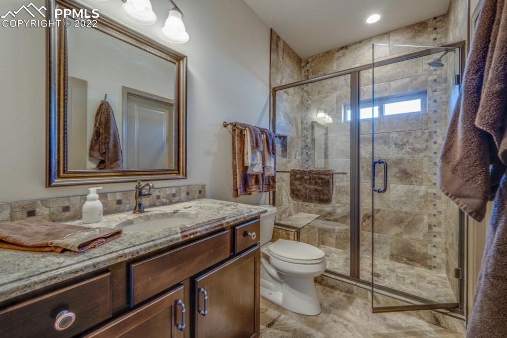 119 Rocchio Drive Florence, CO 81226 - Photo 8 of 48 a bathroom with a granite countertop sink toilet and shower