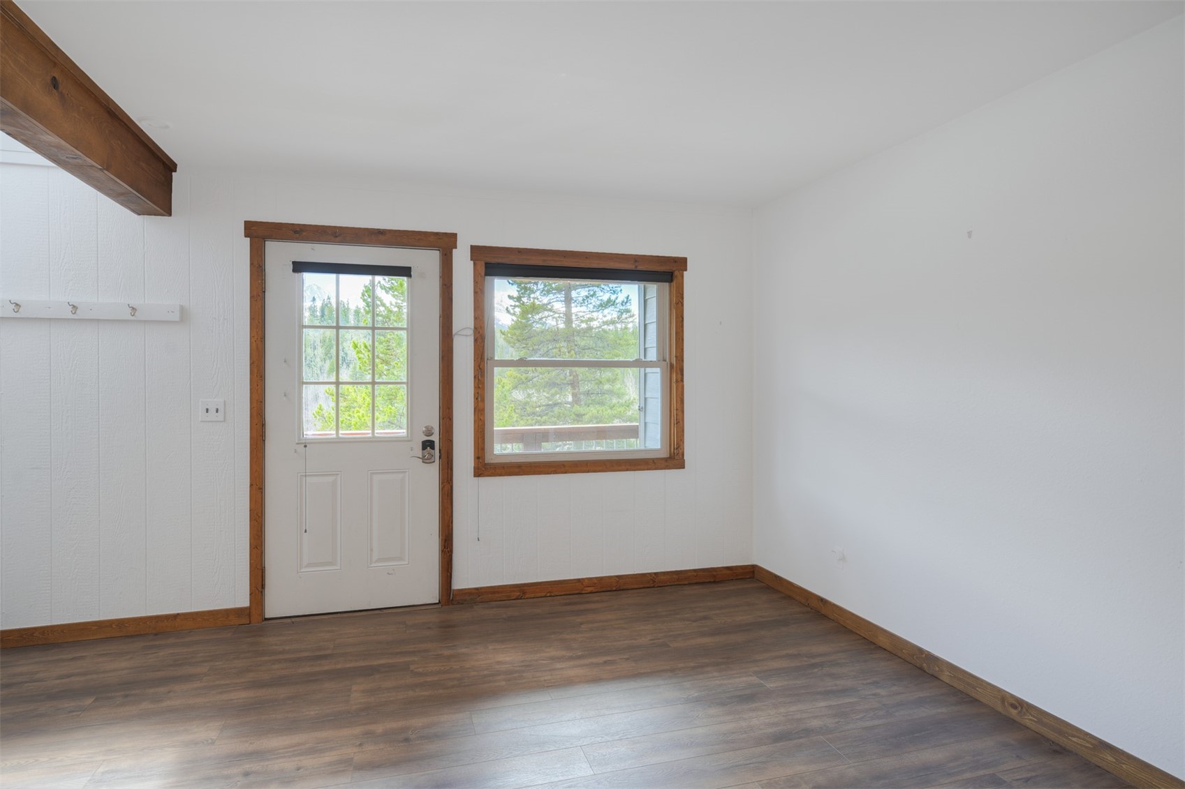 132 Illinois Gulch Road, Unit 3 Breckenridge, CO 80424 - Photo 3 of 32 an empty room with wooden floor and windows