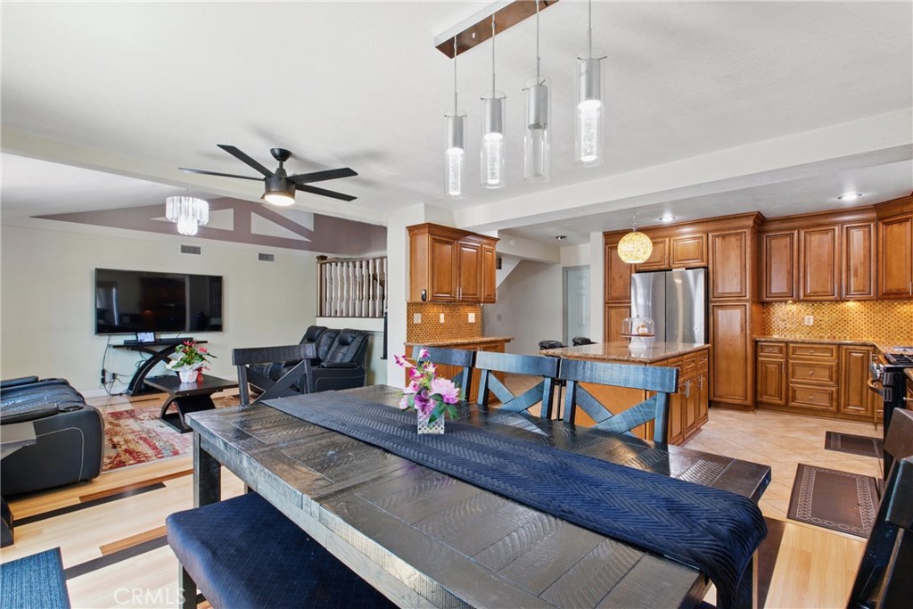 302 East 213th Street Carson, CA 90745 - Photo 14 of 40 a living room with furniture a rug and a flat screen tv