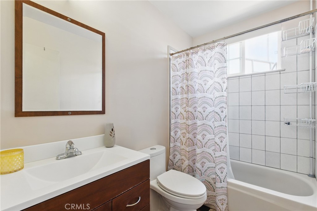 302 East 213th Street Carson, CA 90745 - Photo 19 of 40 a bathroom with a sink toilet and shower