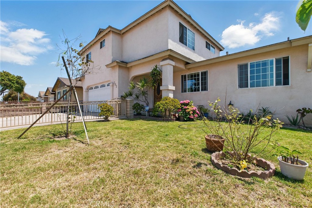 302 East 213th Street Carson, CA 90745 - Photo 2 of 40 a house view with a backyard space