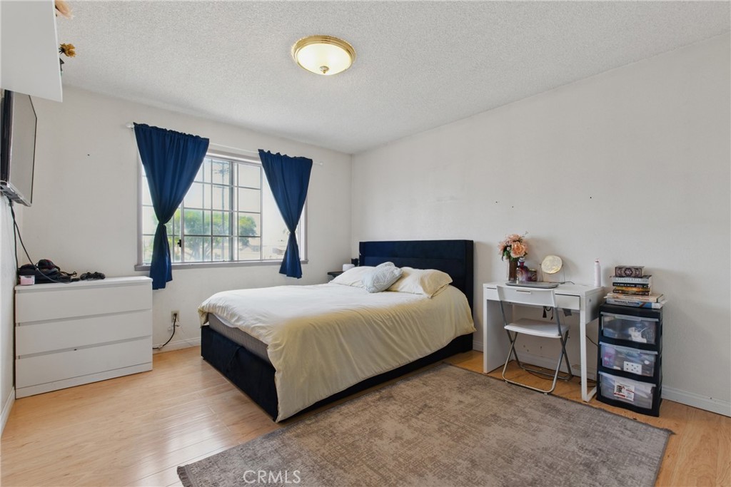 302 East 213th Street Carson, CA 90745 - Photo 27 of 40 a bedroom with a bed and a window